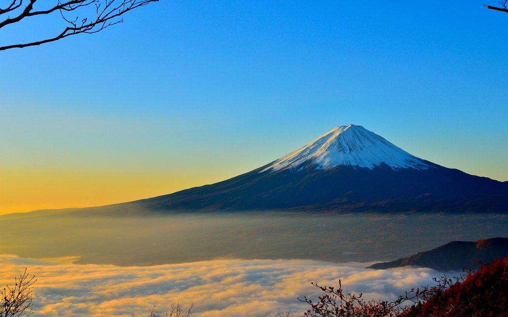 Mount Fuji rising above a sea of cloud at dawn